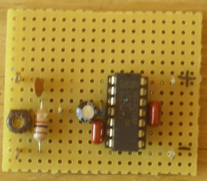 FM quadrature demodulator using a frequency dependent phase shifter (LC tank circuit) and a XOR gate based phase detector on a piece of perforated PCB