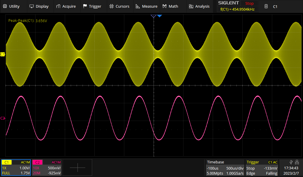 Yellow trace: 455 kHz carrier, amplitude modulated at 80 % depth with a single 1.5 kHz tone. Purple trace: Demodulated audio signal from the infinite impedance detector