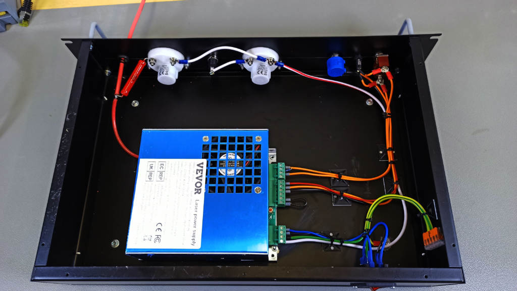 Front facing top-view of the high-voltage power supply and its internal wiring