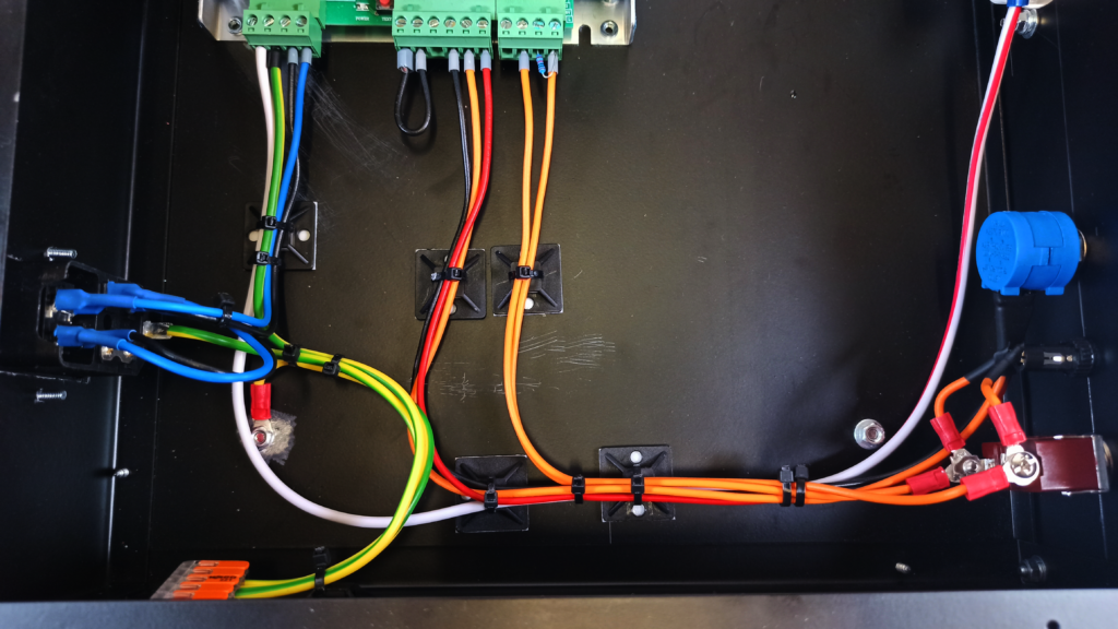 Close-up of the internal wiring: IEC320 mains voltage intput connector (left), VEVOR laser power supply connectors (top) , enable / disable switches and voltage adjustment potentiometer (right)
