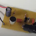 Functional microphone Preamplifier circuit on a small piece of perfboard.